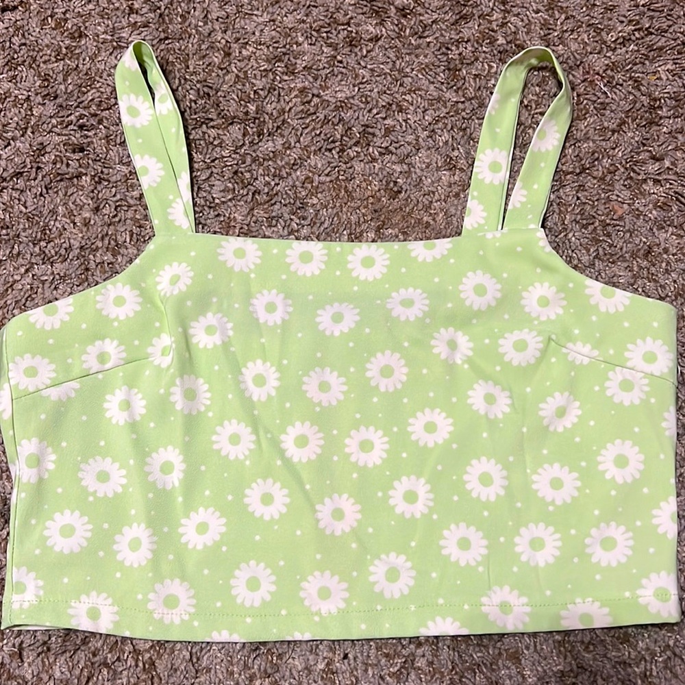 altars state cropped tank top. green with white flowers